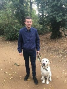 Alex and his guide dog River