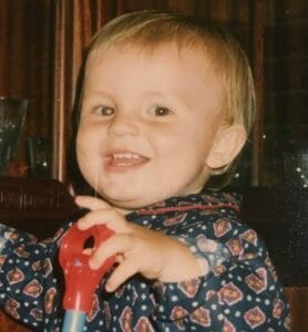 Alex at two years old with a white 'glow' in the eye.