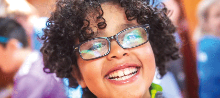 Isaac smiling on a sailing trip