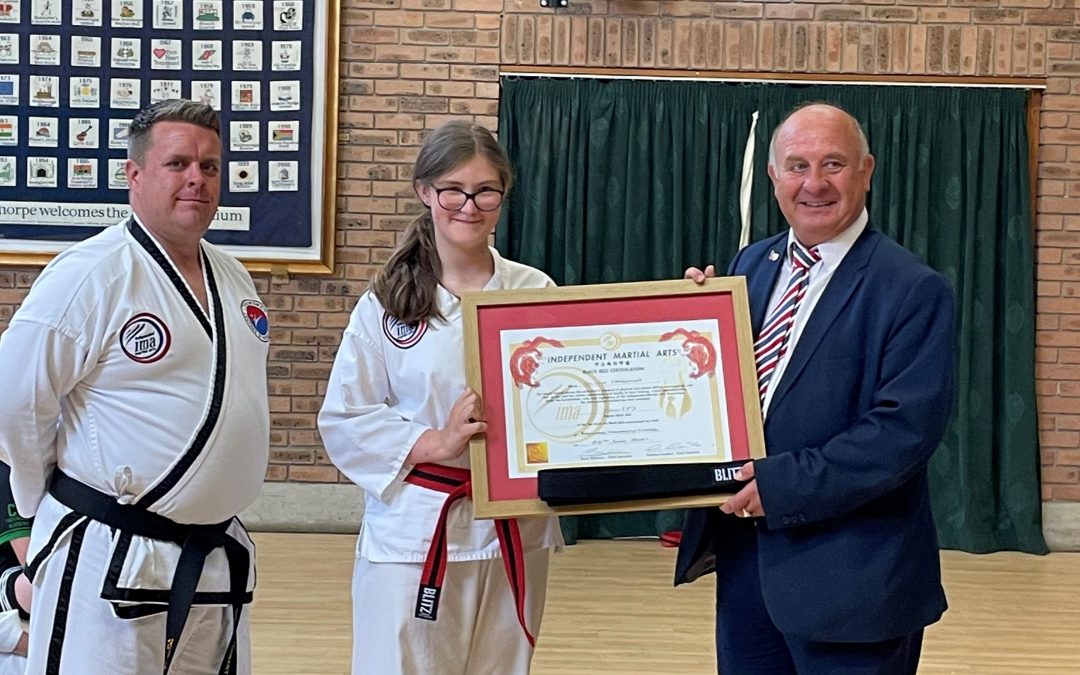 Olivia Earns A Black Belt in Taekwondo