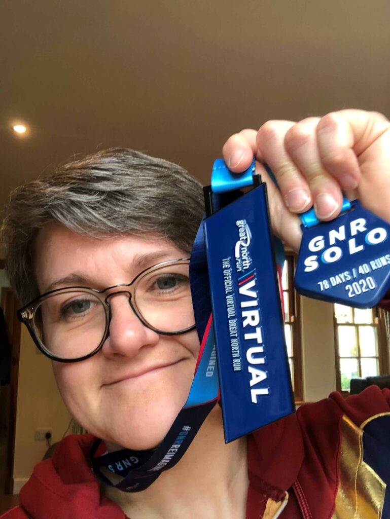 Alexandra smiling with a mdeal