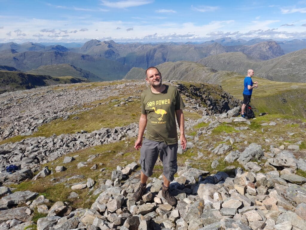 Colin stood outside on a mountain
