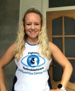 Sabina smiling in a CHECT top