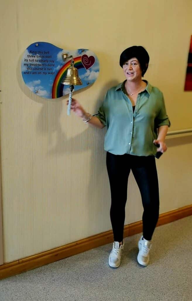 Lisa ringing the bell at hospital 