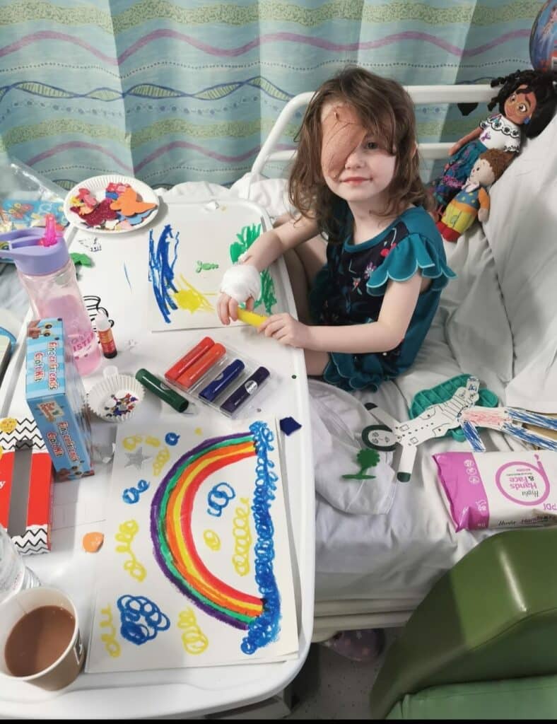 Bonnie sat in hospital with lots of drawings she made - including a rainbow