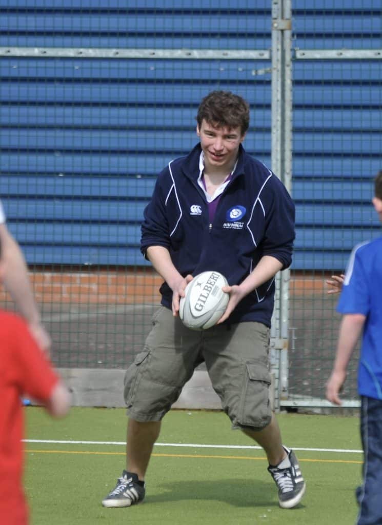 Steven playing rugby