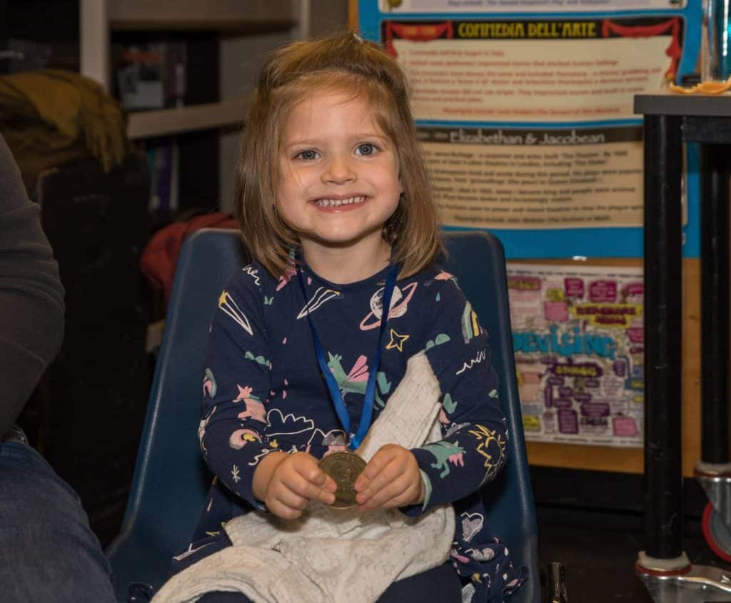 Isla with her CHECT Champion award for her bravery during retinoblastoma - eye cancer