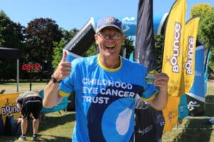 Rochard is smiling in a CHECT top in front of CHECT banners