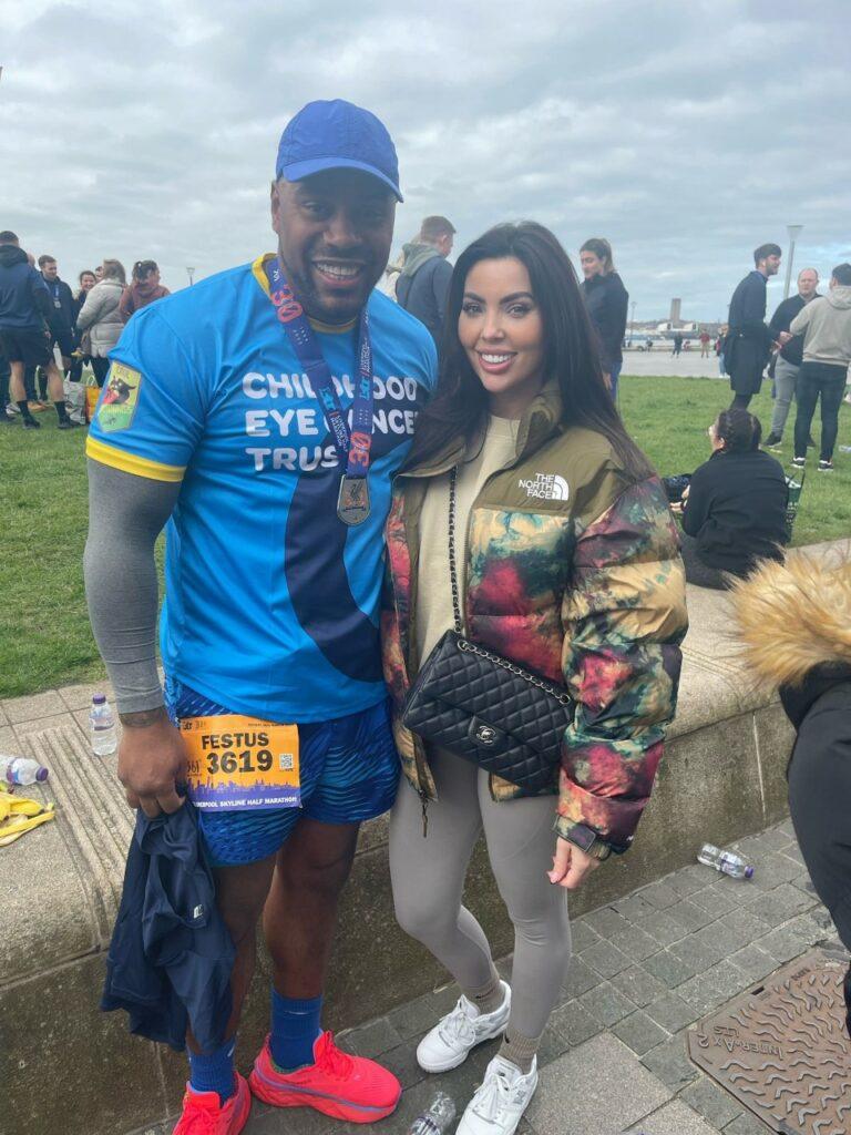 Festus with his partner stood outside smiling