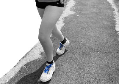 A person is cycling, wearing CHECT laces