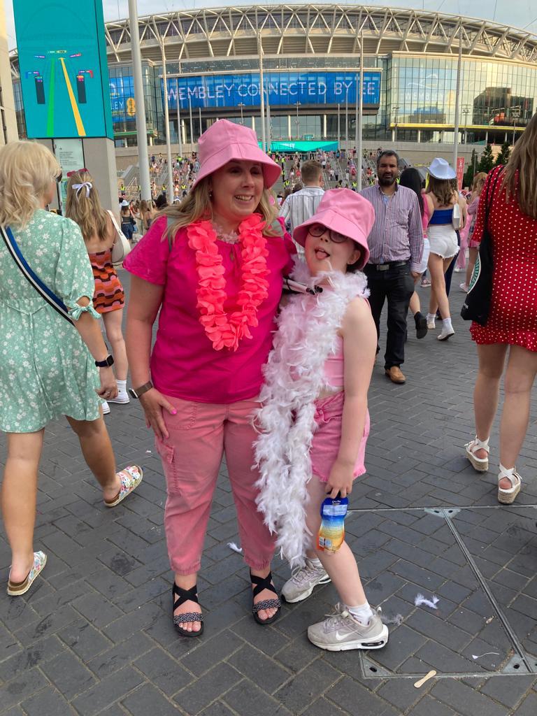 Kerrie and Megan stood outside of the venue smiling