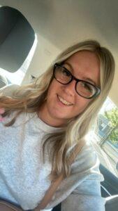 Becky is smiling at the camera