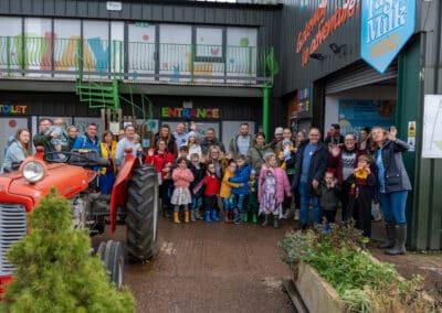 A group photo outside of the farm extrance on a cloudy, but fun day!