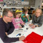 A family are gathered around a table