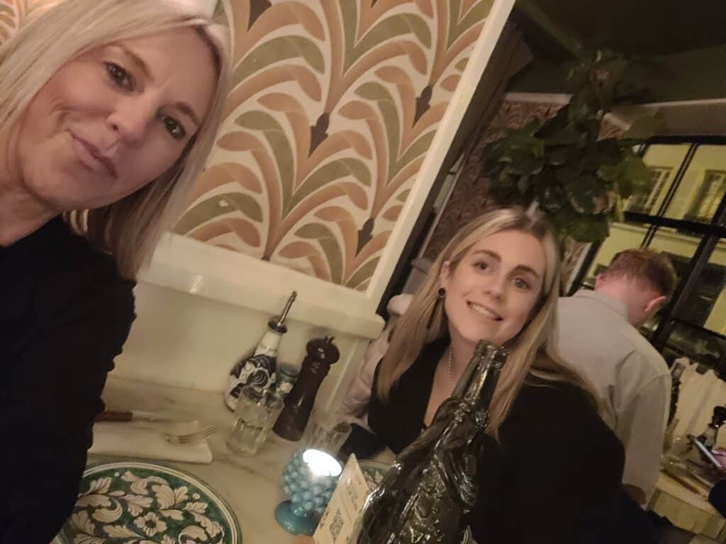 Kay with her daughter Maisy who had retinoblastoma, eye cancer, sat inside eating dinner