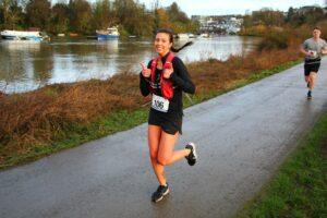 Hannah is running outside, smiling
