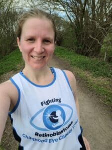 Sophie running in a CHECT running vest