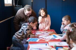 A family are looking at things on a table