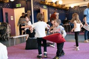 Boys are playing with cushions