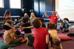 The group are sat together playing