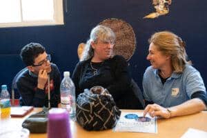 Petra is talking to a boy and mum