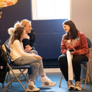 Lena is engaging with a mum and daughter