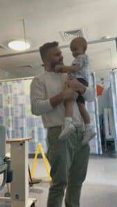 Zulkernan is holding his son