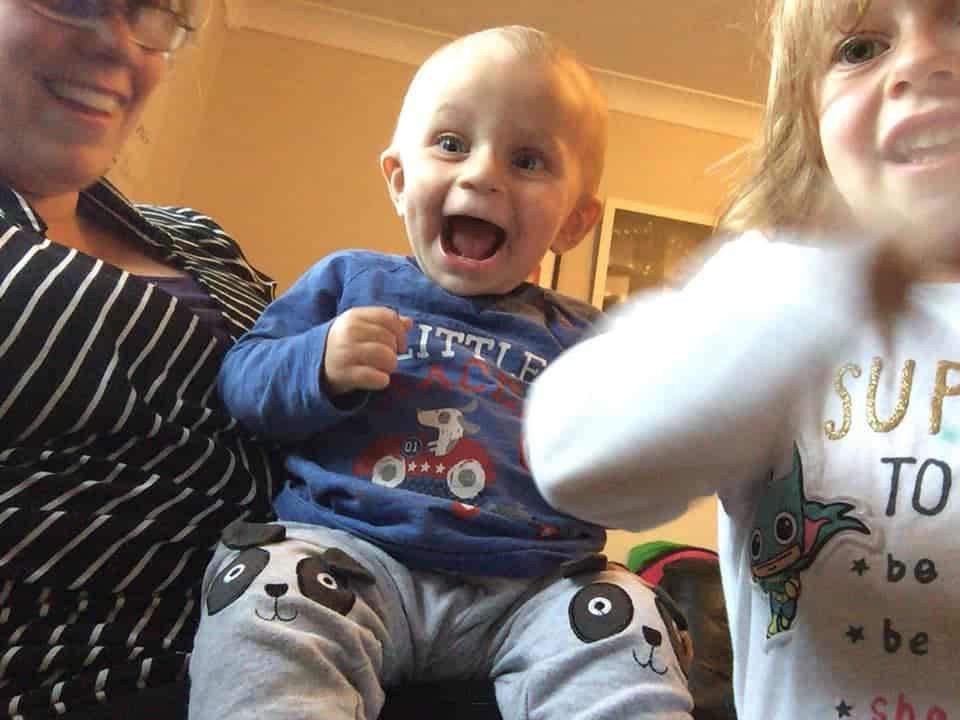 Baby Ethan with his sister and mum
