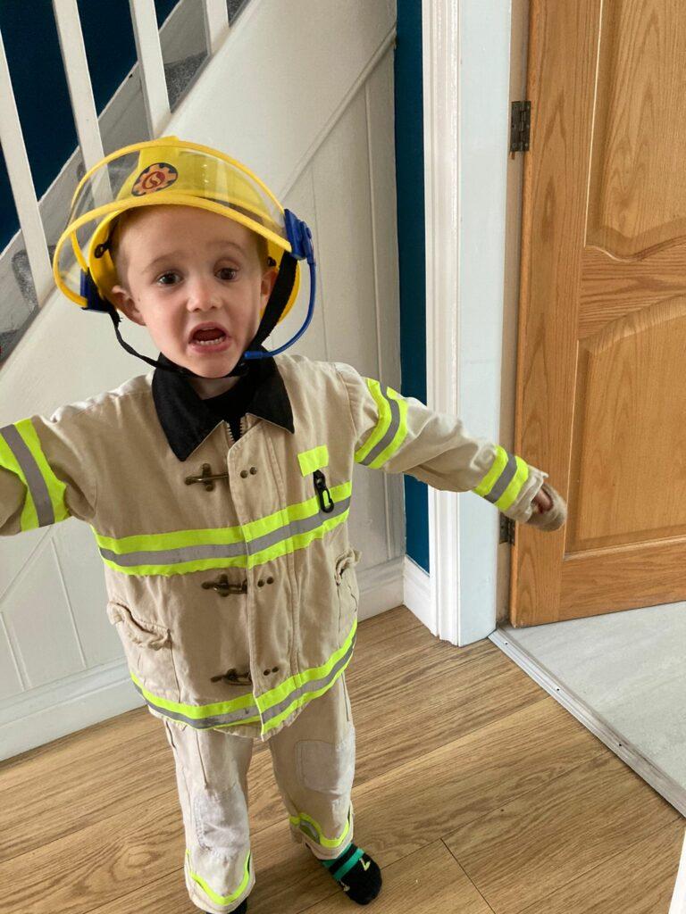 Harry is dressed as a fireman