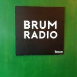 The door reads 'Brum radio'
