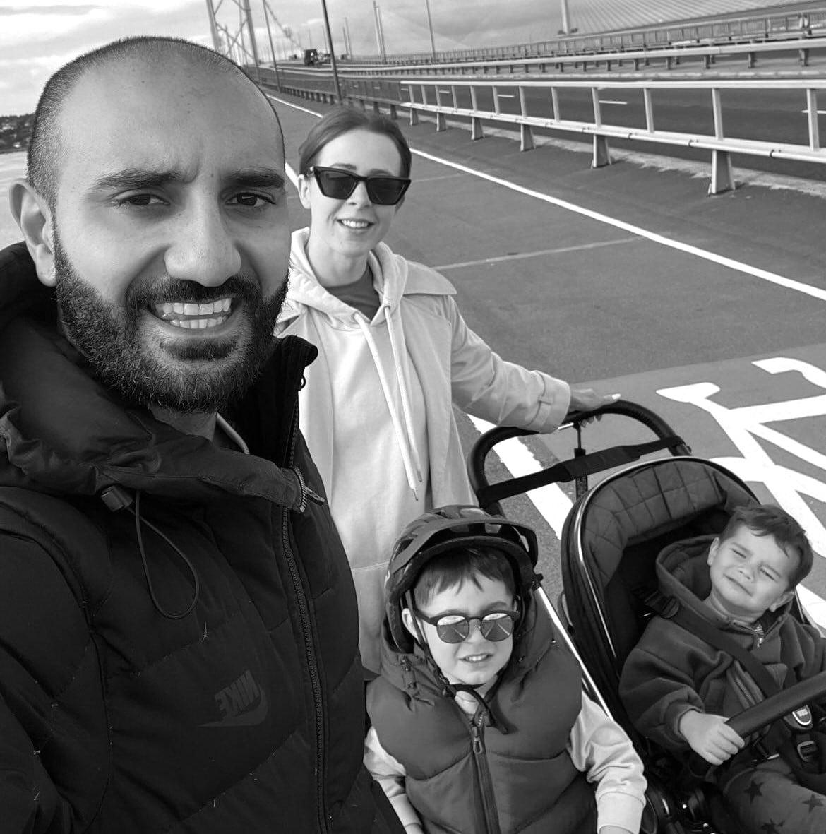 IMG_20231005_131839_737 Family of four pushing a buggy over a bridge whilst walking 50km for Childhood Eye Cancer Trust