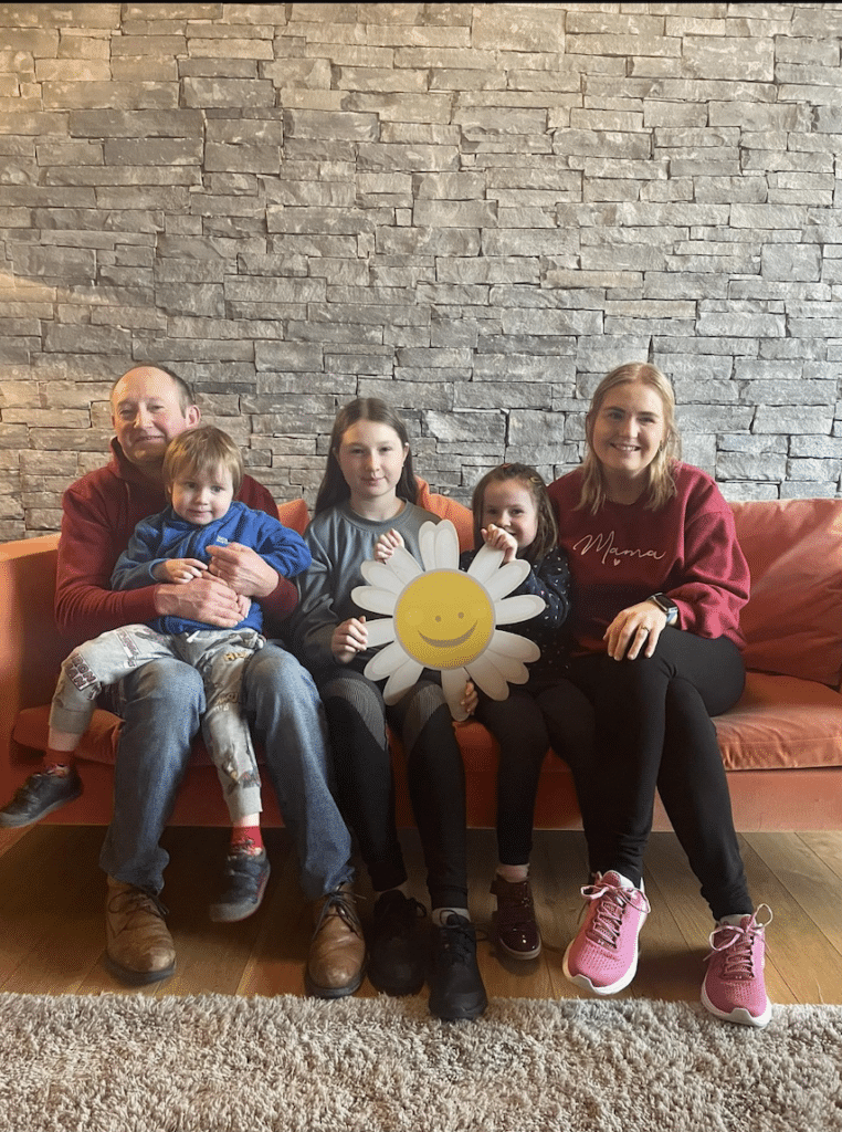 Rachel sat with her family