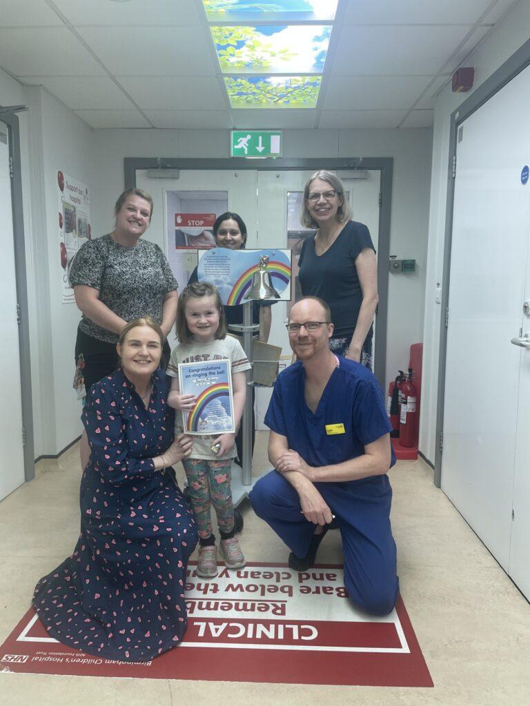 Rachel at the hospital with staff at the end of her treatment