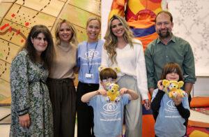 The family are stood with the celebs and Lena