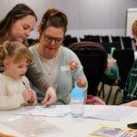 A family are drawing