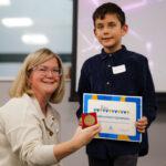A boy receives his certifictae