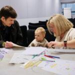 Sarah is talking to a family