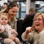 Support worker sarah is laughing with a family