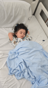 Shuhd in a hospital bed asleep