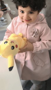 Shuhd with a teddy smiling