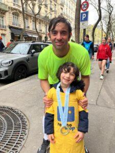 Iian is on a street with a child