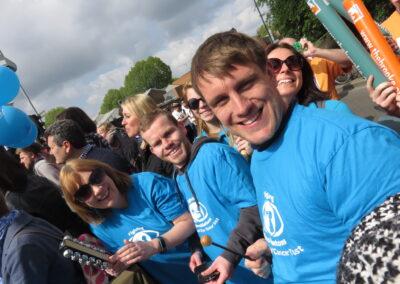 CHECT members and staff taking a selfie together at the london marathon cheer point - they're all in CHECT t-shirts